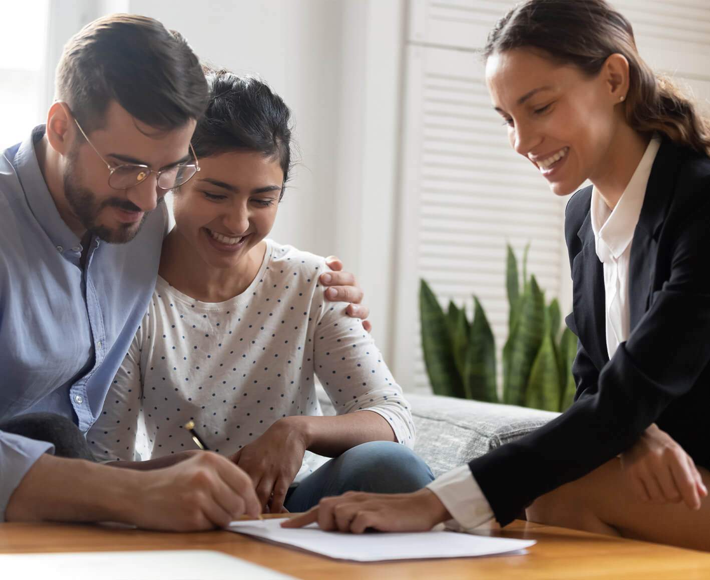 happy couple signing paperwork for real estate deal happy couple signing paperwork for real estate deal